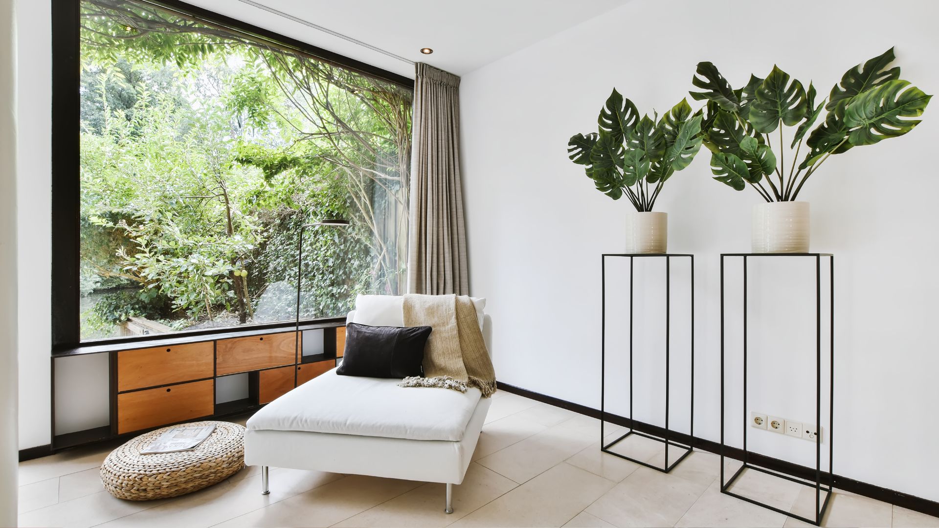 A living room filled with furniture and a large window