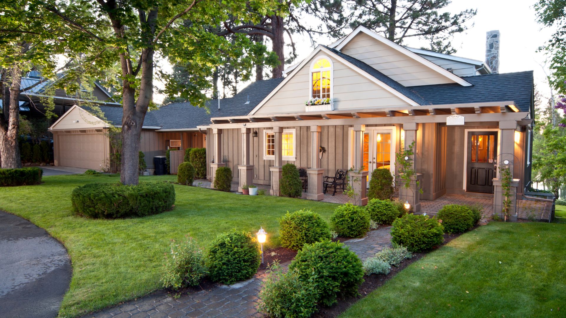 A small house with a lot of green grass