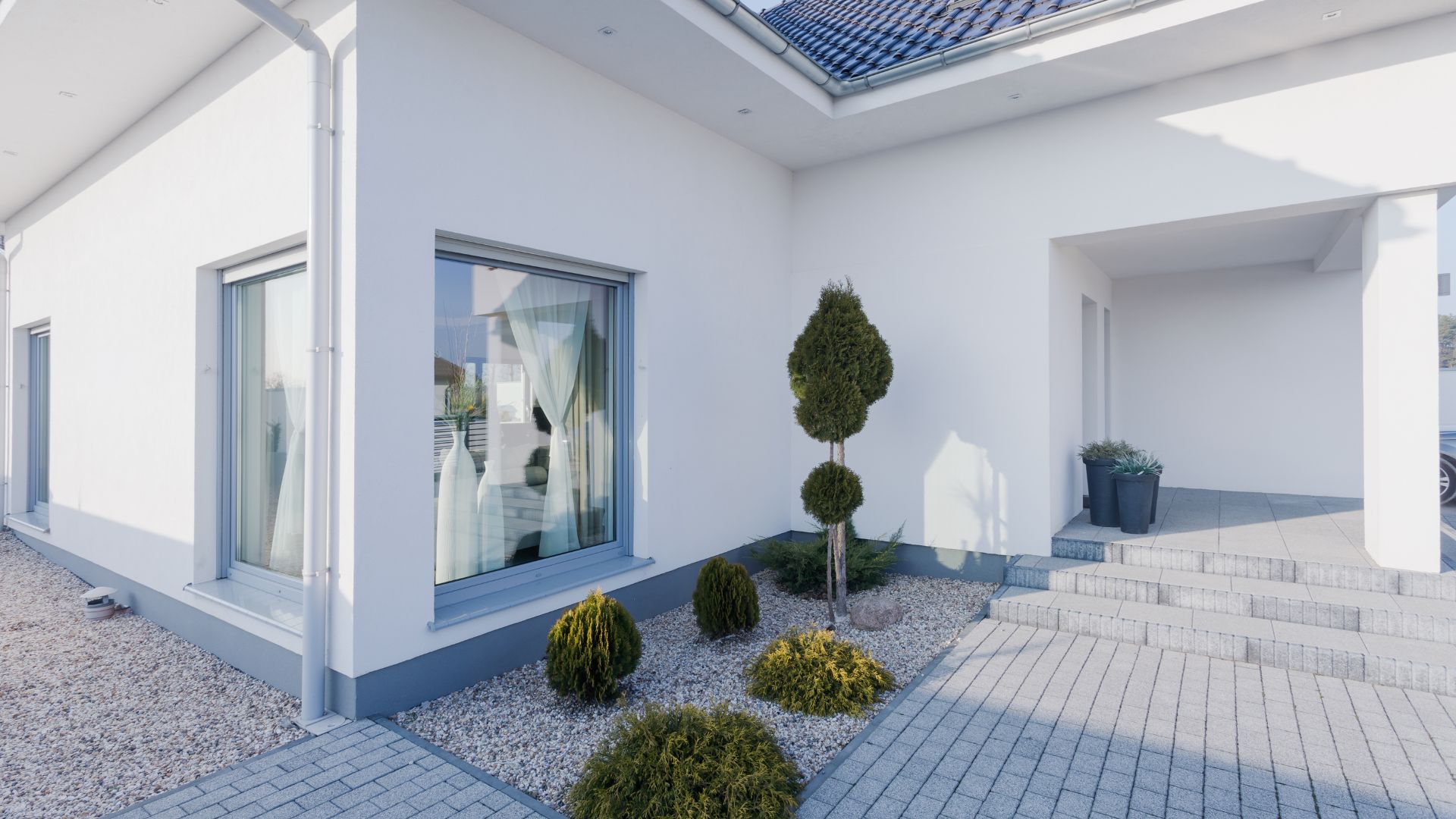 A white house with a skylight on the roof