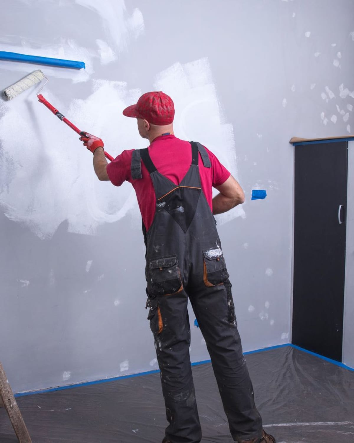 Rolling primer over carefully patched drywall — the prep work Great Falls Painters is known for